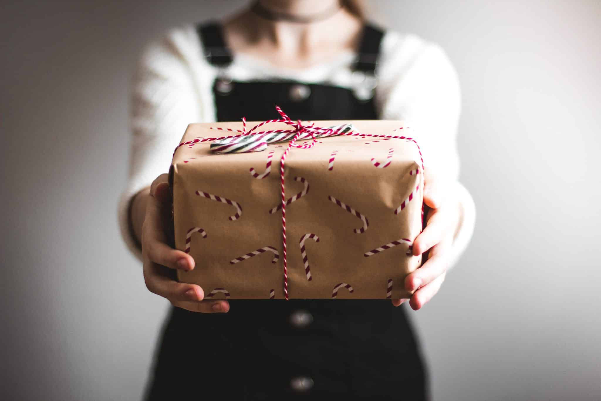 woman displaying wrapped present